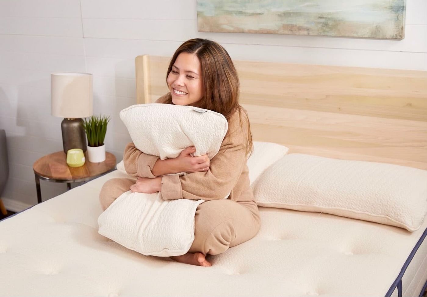 woman sitting on certified organic mattress